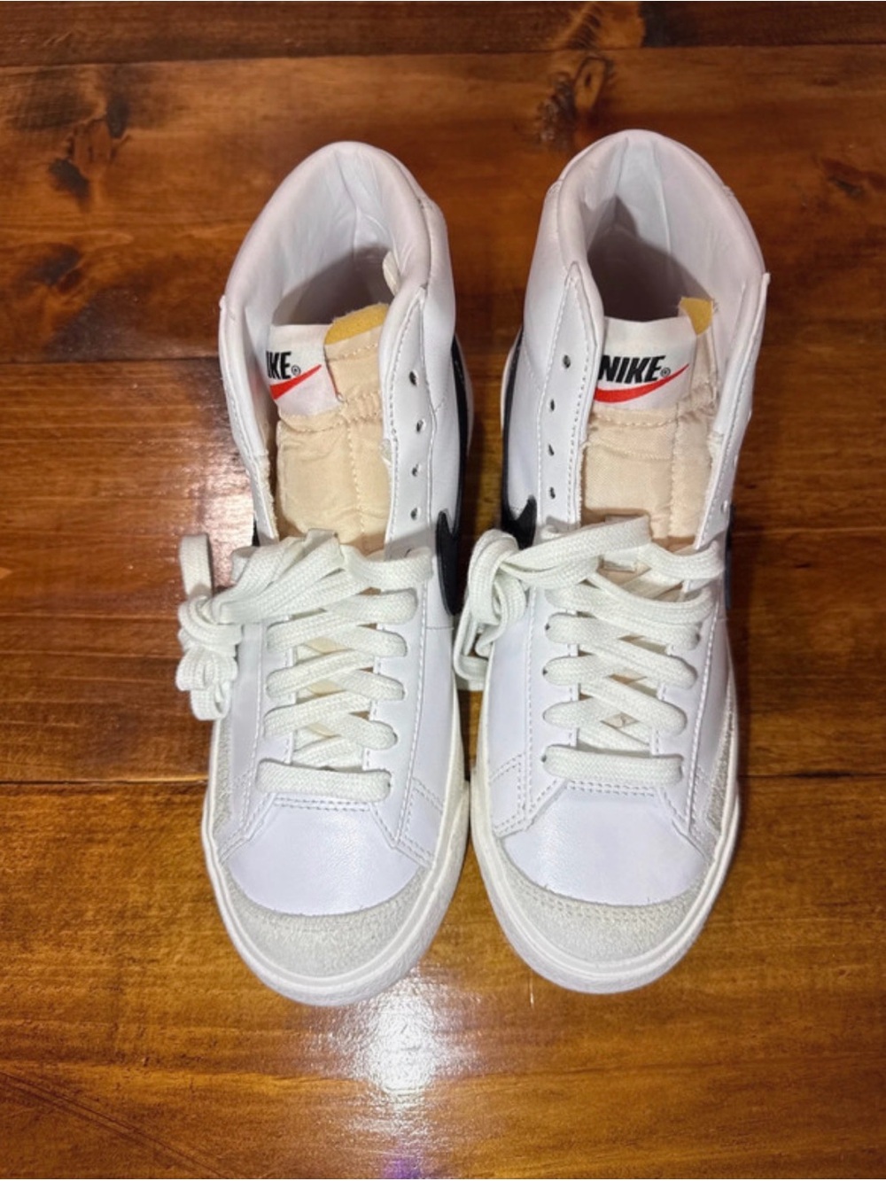 Nike White High-Top Sneakers with Black Swoosh